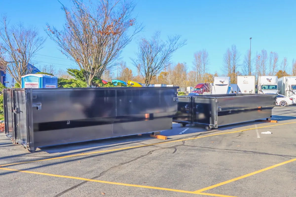 Professional dumpster rental service with roll-off container on residential driveway in Willow Park